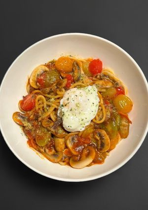 A picture of Mushroom & Cherry Tomato Pasta with Poached Egg.