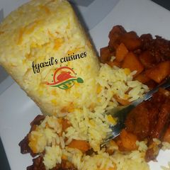 A picture of Carrot rice and potato soup.