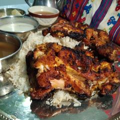 A picture of Chicken Tikka With Tarka Rice.