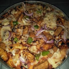 A picture of Chicken chunks Pizza.