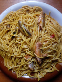 A picture of Jollof spaghetti with geisha.