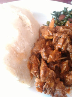 A picture of Ugali with fried beef and skuma.