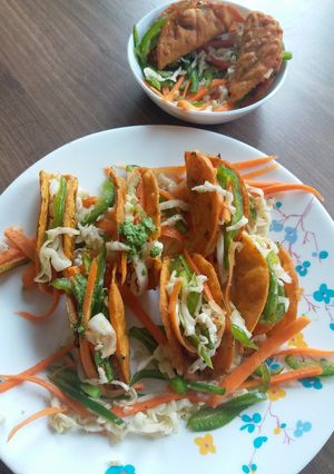 A picture of Backed veg tacos.