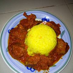 A picture of Turmeric rice and stew.