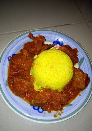 A picture of Turmeric rice and stew.
