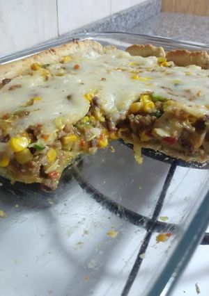 Una foto de Tarta de masa casera rellena de carne molida, zapallitos, choclo