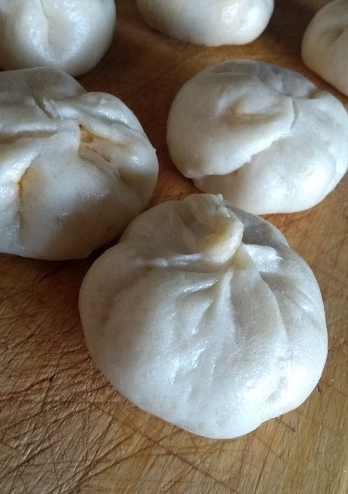 Una foto de Dumplings (al vapor) de cerdo y opción de pollo picante
