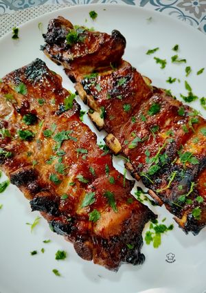 A picture of Caramelized Pork Ribs with Peking Duck Sauce.