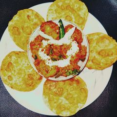 A picture of Kashmiri dum aloo with sattu ki kachori.