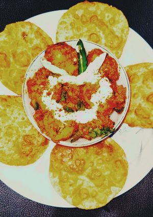 A picture of Kashmiri dum aloo with sattu ki kachori.