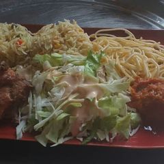 A picture of Coconut fried rice,spagetti with fried chicken and cabbage salad.