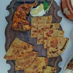A picture of Chicken roste with layered paratha.