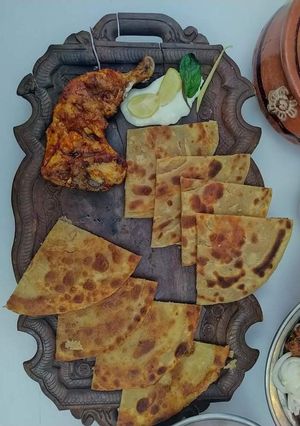 A picture of Chicken roste with layered paratha.