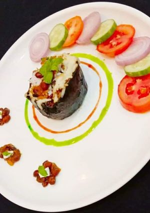 A picture of Cheesy Kidney Beans Rice Stuffed Eggplant.