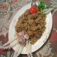 A picture of Chicken dum Biryani with Potatoes.