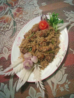 A picture of Chicken dum Biryani with Potatoes.