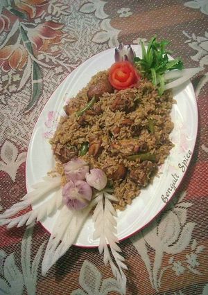 A picture of Chicken dum Biryani with Potatoes.