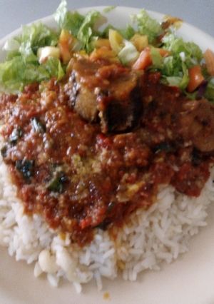 A picture of White rice with stew.