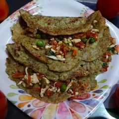 A picture of Green moong dal chilla with paneer stuffing.