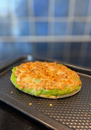 A picture of Tuna melt on pita bread - open sandwich.