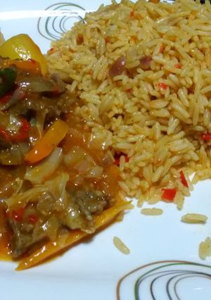 A picture of #jollofricecontest#jollof rice and beef gravy.
