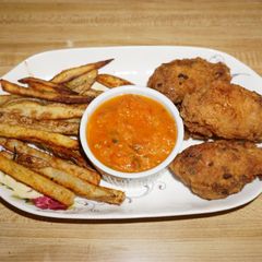 A picture of FRIED CHICKEN WINGS, ROASTED ROSEMARY POTATOES, HOT SALSA. JON STYLE.