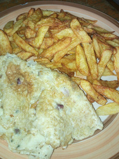 A picture of Chips and fried egg.