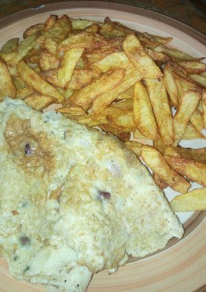 A picture of Chips and fried egg.
