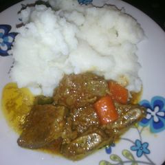 A picture of Beef stew and carrots.