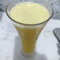A picture of Paineapple and mint leave drink.