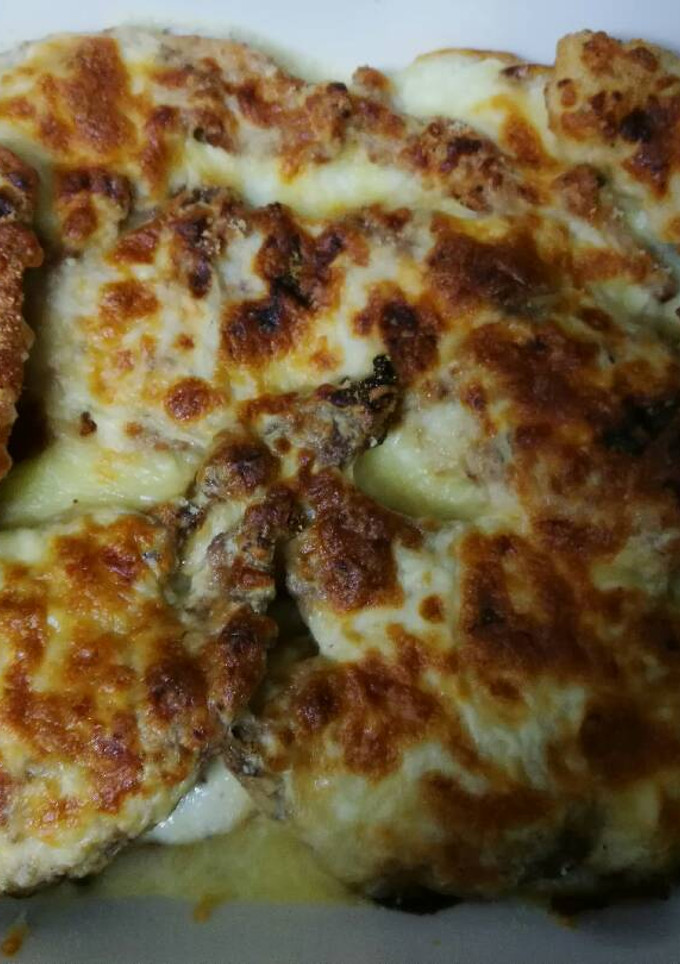 Una foto de Lomo con patatas y bechamel