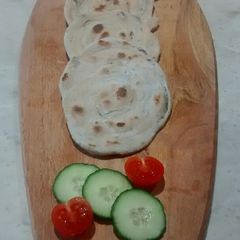 A picture of Pesto and Tomato flatbread.