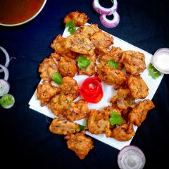 A picture of Masoor dal pakode (red lentils fritters).