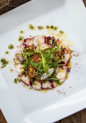 A picture of Octopus Salad with pepper dressing.