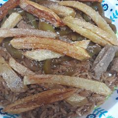 A picture of Lomo Saltado.