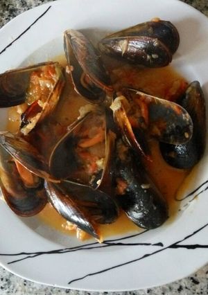 Una foto de Mejillones picantes al cilantro