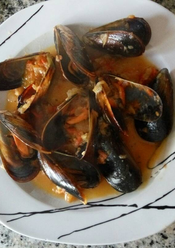 Una foto de Mejillones picantes al cilantro
