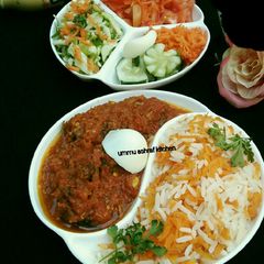 A picture of Carrot rice wit soup and salad.
