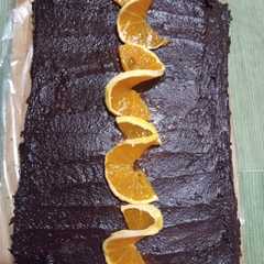 Una foto de Torta naranja, chocolate y crema