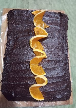Una foto de Torta naranja, chocolate y crema
