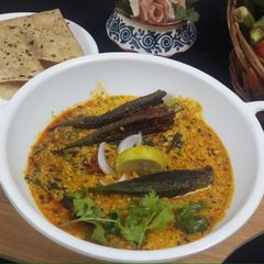 Bharwa bhindi in dahi kadi A picture of Bharwa bhindi in dahi kadi.