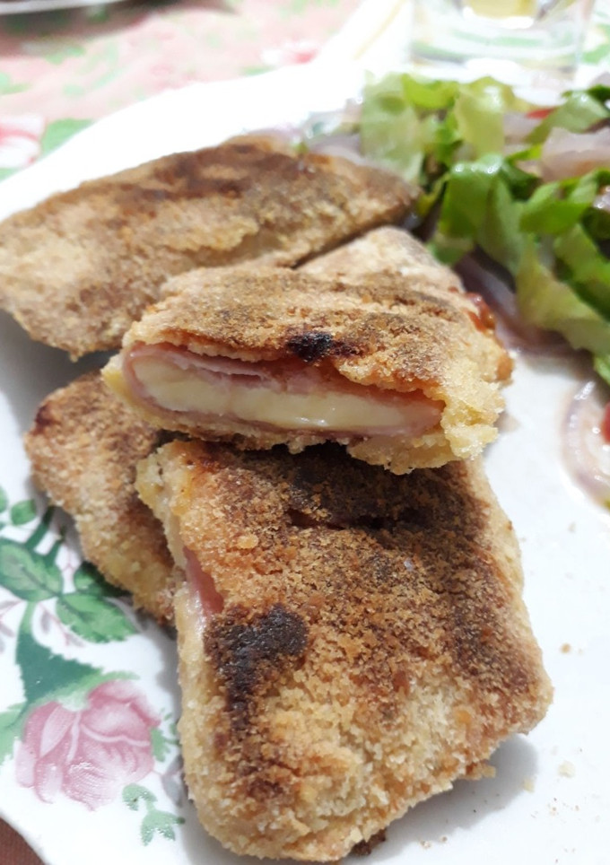 Una foto de Milanesas de jamón y queso al horno