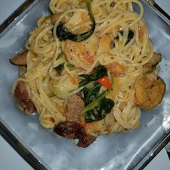 A picture of Shrimp and sausage w/Angel hair pasta in a Cajun cream sauce.