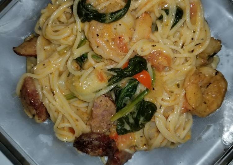Steps to Make Perfect Shrimp and sausage w/Angel hair pasta in a Cajun cream sauce