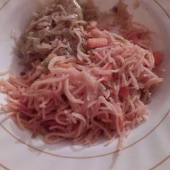 A picture of Carrot spaghetti with steamed cabbage.