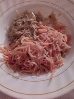 A picture of Carrot spaghetti with steamed cabbage.