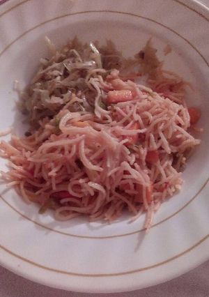 A picture of Carrot spaghetti with steamed cabbage.