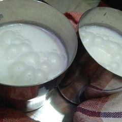 A picture of Buttermilk with basil leaves.