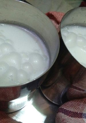 A picture of Buttermilk with basil leaves.
