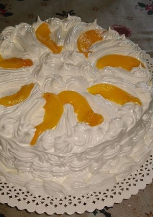 Una foto de Torta de crema y duraznos